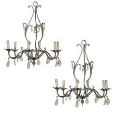 A Pair of French Painted Iron and Crystal Six-Light Chandeliers with Leaf Motifs