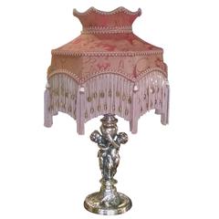 Antique Brass Table Lamp of a Pair of Cherubs Embracing, circa 1900