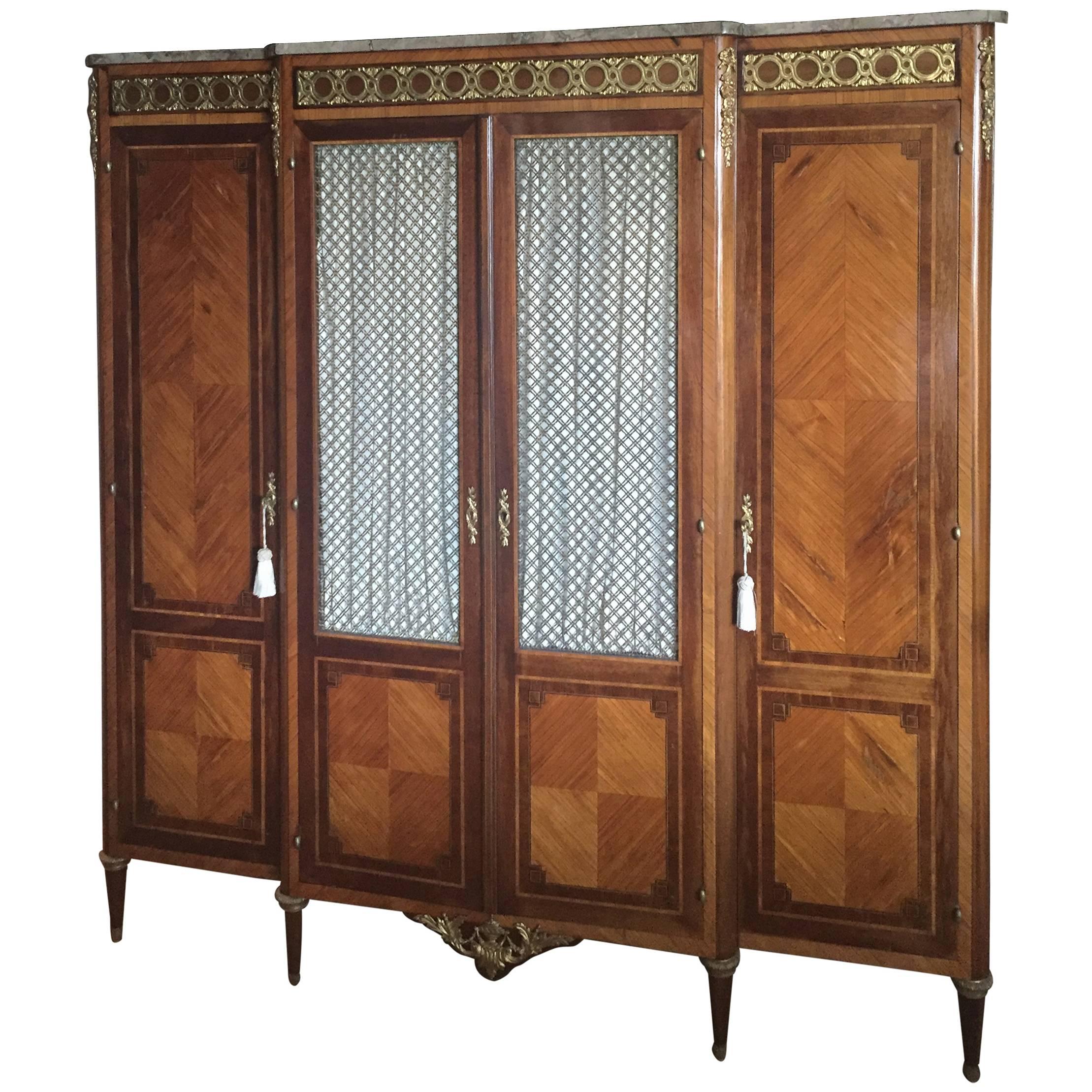 We have enjoyed this in our house for 15 years as a tv cabinet. We removed the back of the middle section only and as a wall piece it works great. The cabinet is wonderful quality of breakfront form with beautiful Marquetry work and gilt bronze