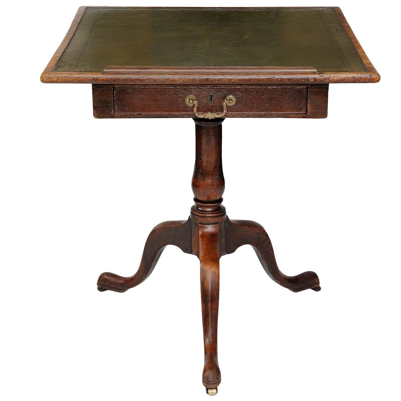 This is a rare and rather beautiful English George III Chippendale style 18th century metamorphic oak reading/architects table with adjustable tooled leather top.

The table consisting of a rising leather tooled top, capable of locking at