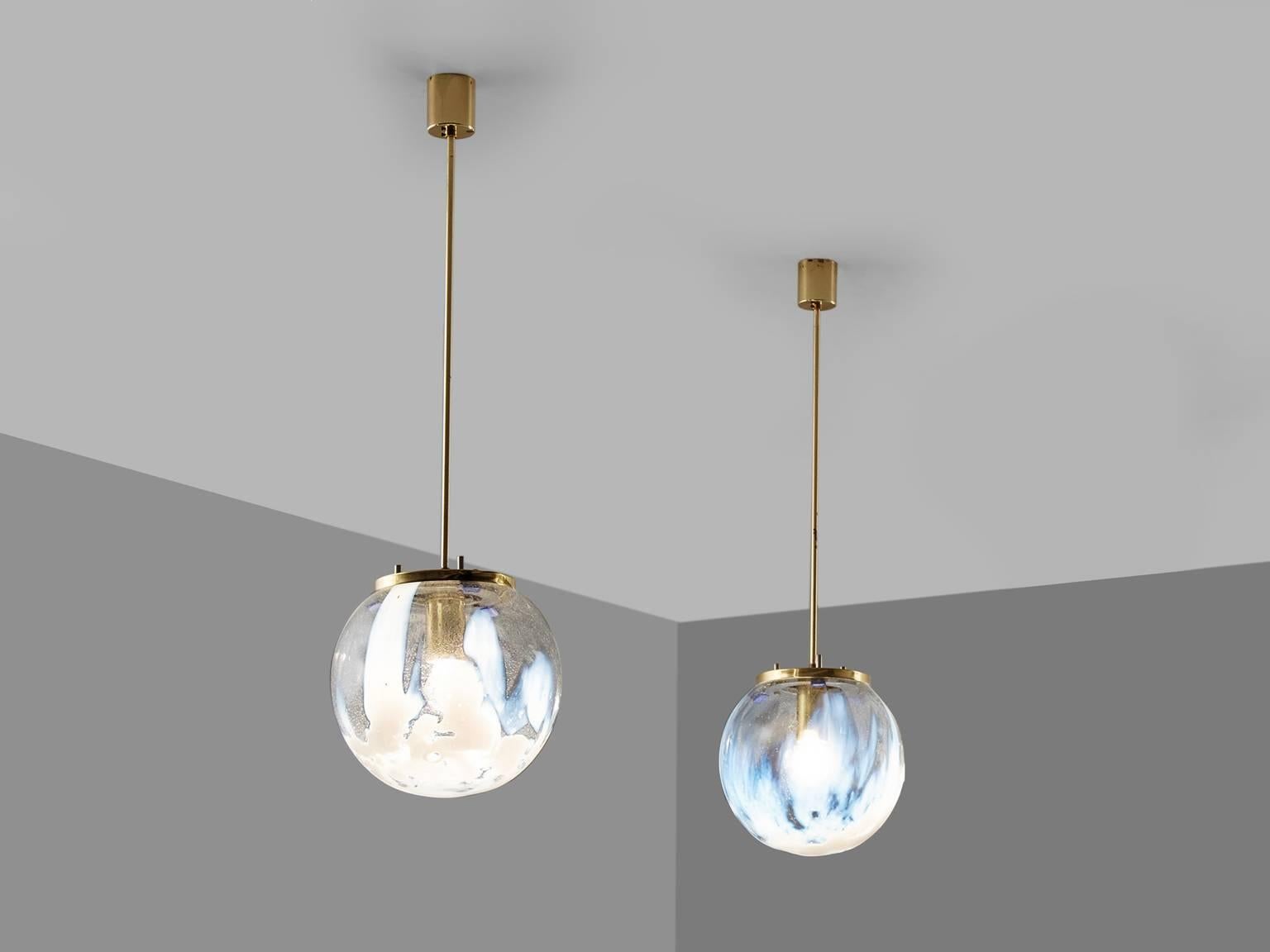Set of 2 pendants in glass and brass, Italy, 1950s.

Wonderful ceiling lamp with art glass spheres, mounted to a brass element with a tubular rod to the ceiling. It is nicely finished with a cylindrical canopy, well made in brass as well. The