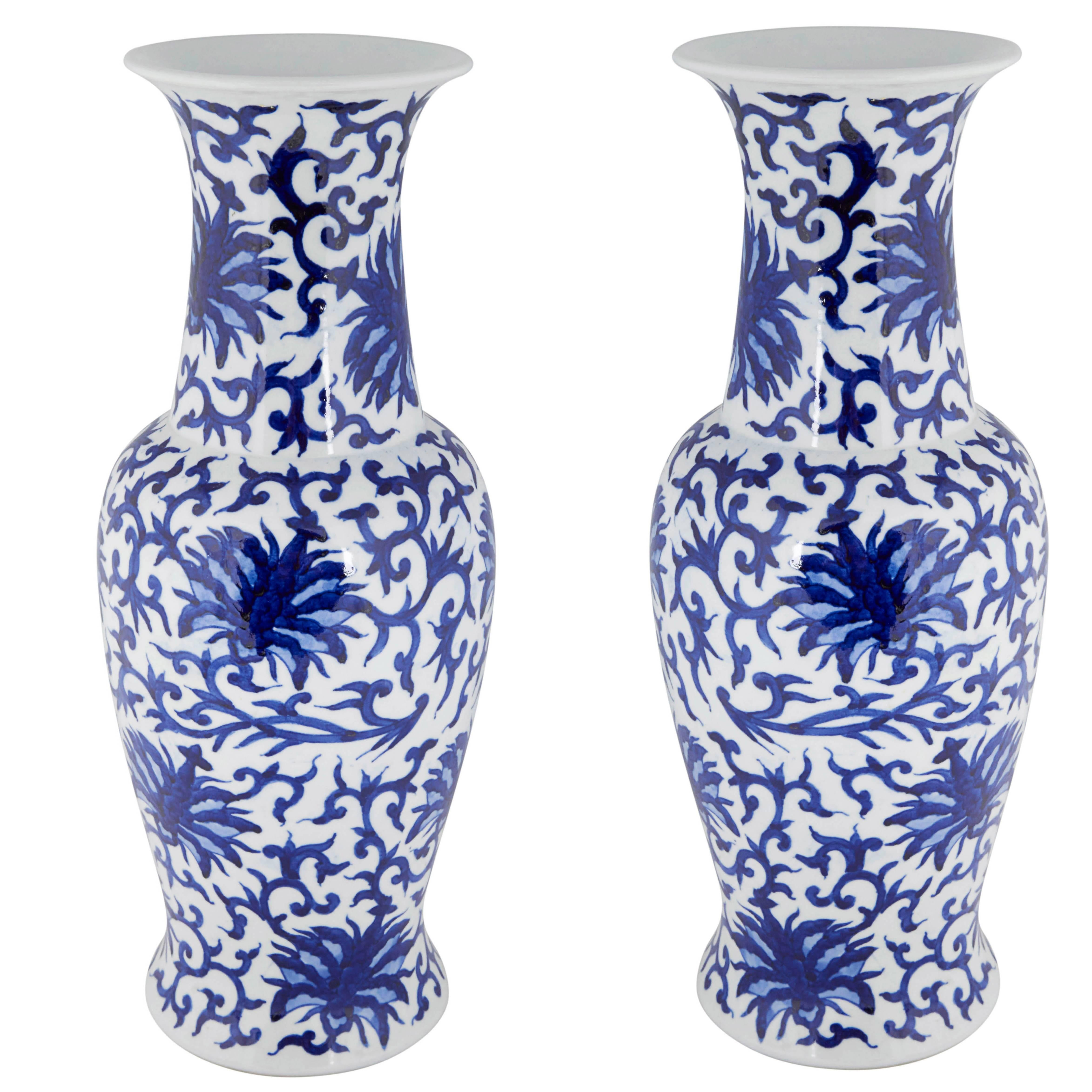 Pair of Chinese White and Blue Ceramic Vases with Floral Motifs
