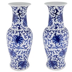 Pair of Chinese White and Blue Ceramic Vases with Floral Motifs