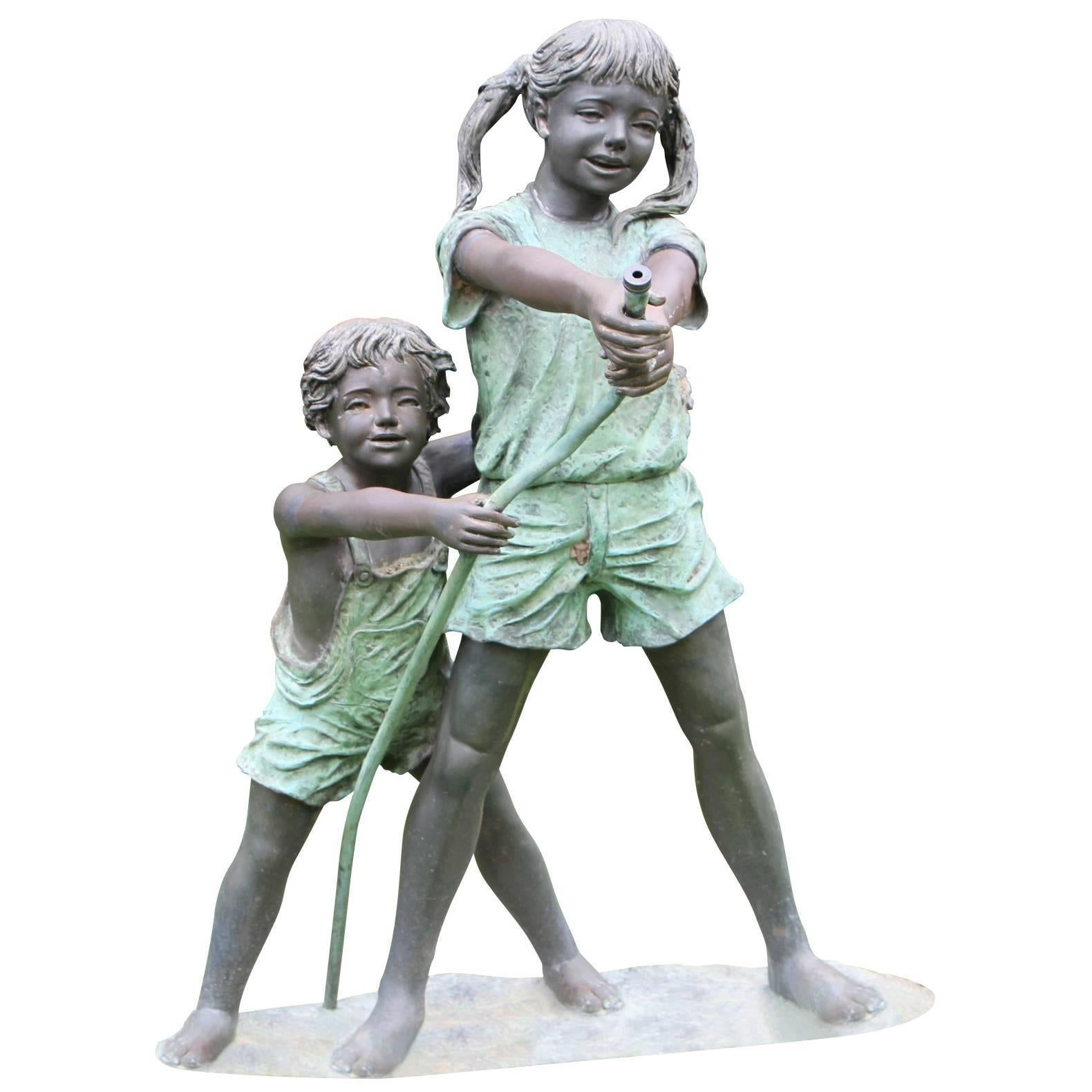 Bronze Boy and Girl with Hose Sculpture