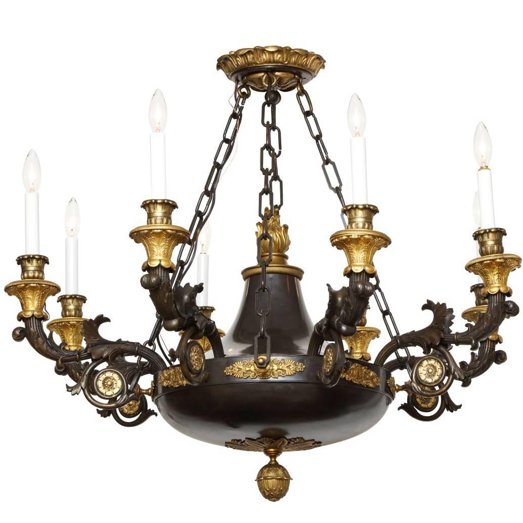 A French Empire Patinated Bronze and Gold Doré Eight-Light Chandelier