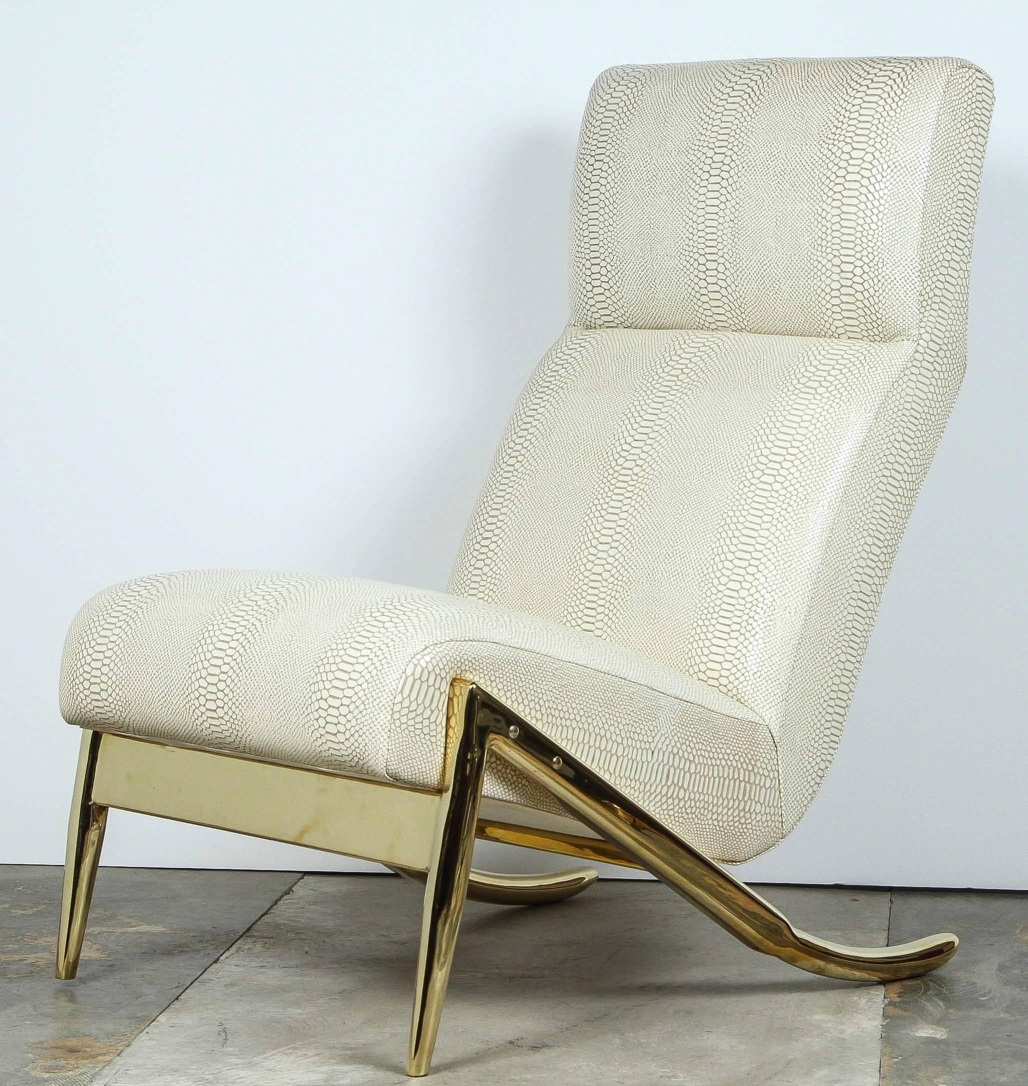 Contemporary Paul Marra Slipper Chair in unlacquered polished brass and upholstered in faux python. Brass is unlacquered therefore will patina naturally.  Faux python is by availability and may vary from imaging.  By order. Price quoted is per each. 