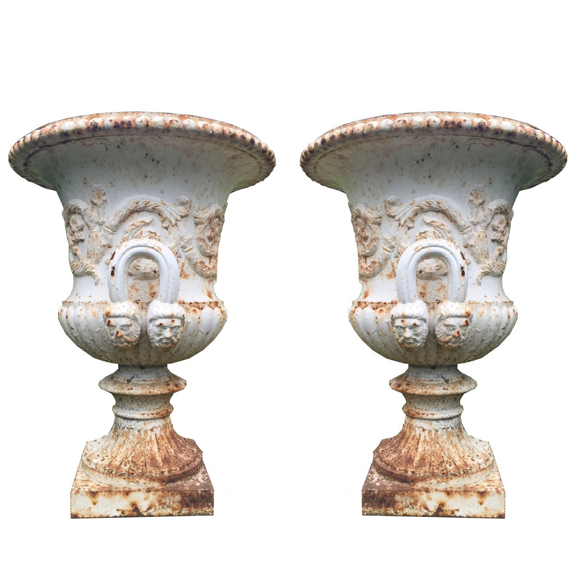 19th century pair of antique cast iron urn.