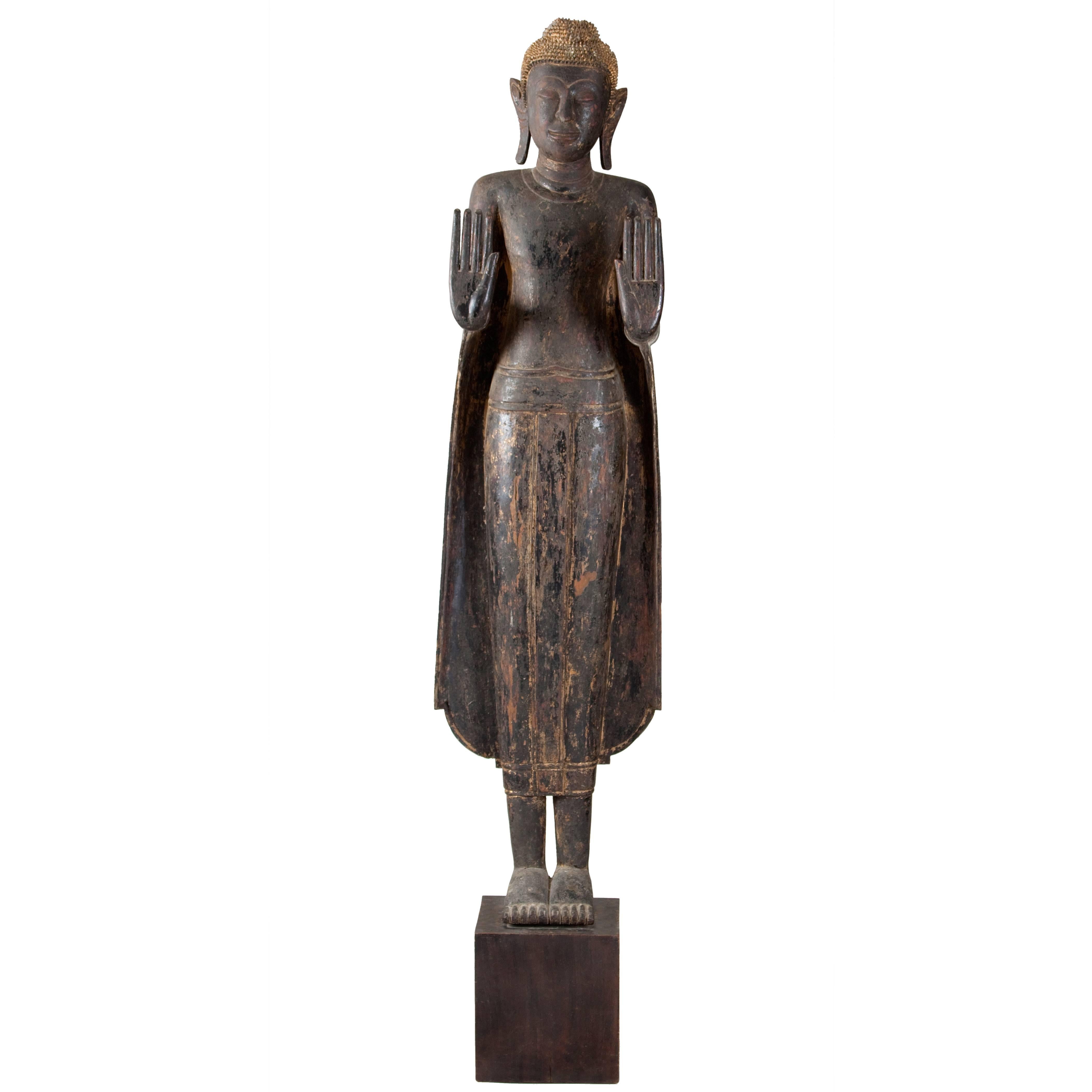 Thai Painted and Parcel Gilt Wooden Standing Buddha