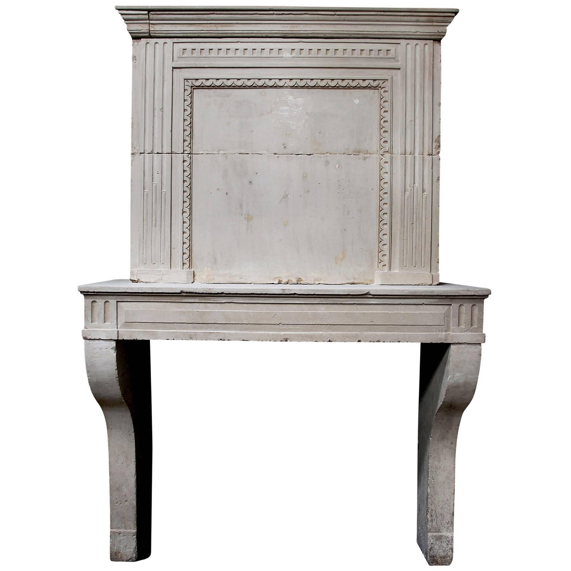 Late 18th Century French Louis XVI Limestone Fireplace with Trumeau