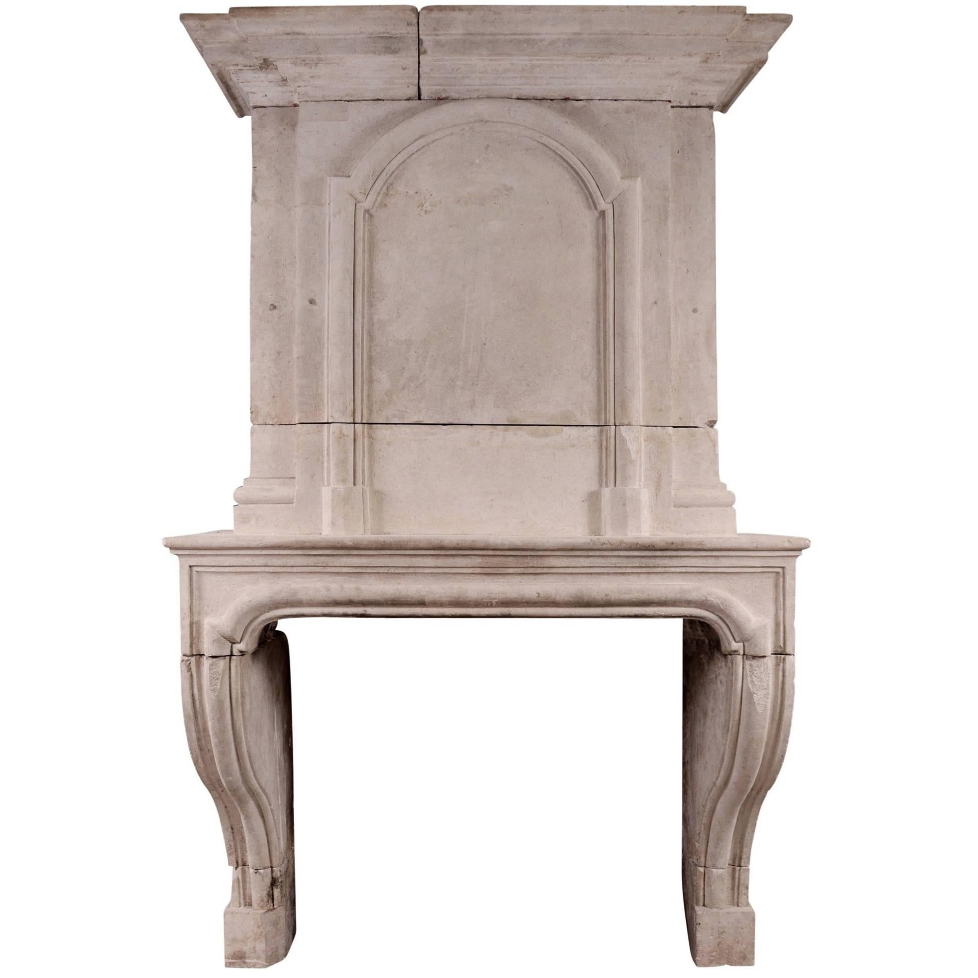 Early 18th Century Louis XIV Limestone Fireplace with Pannelled Trumeau
