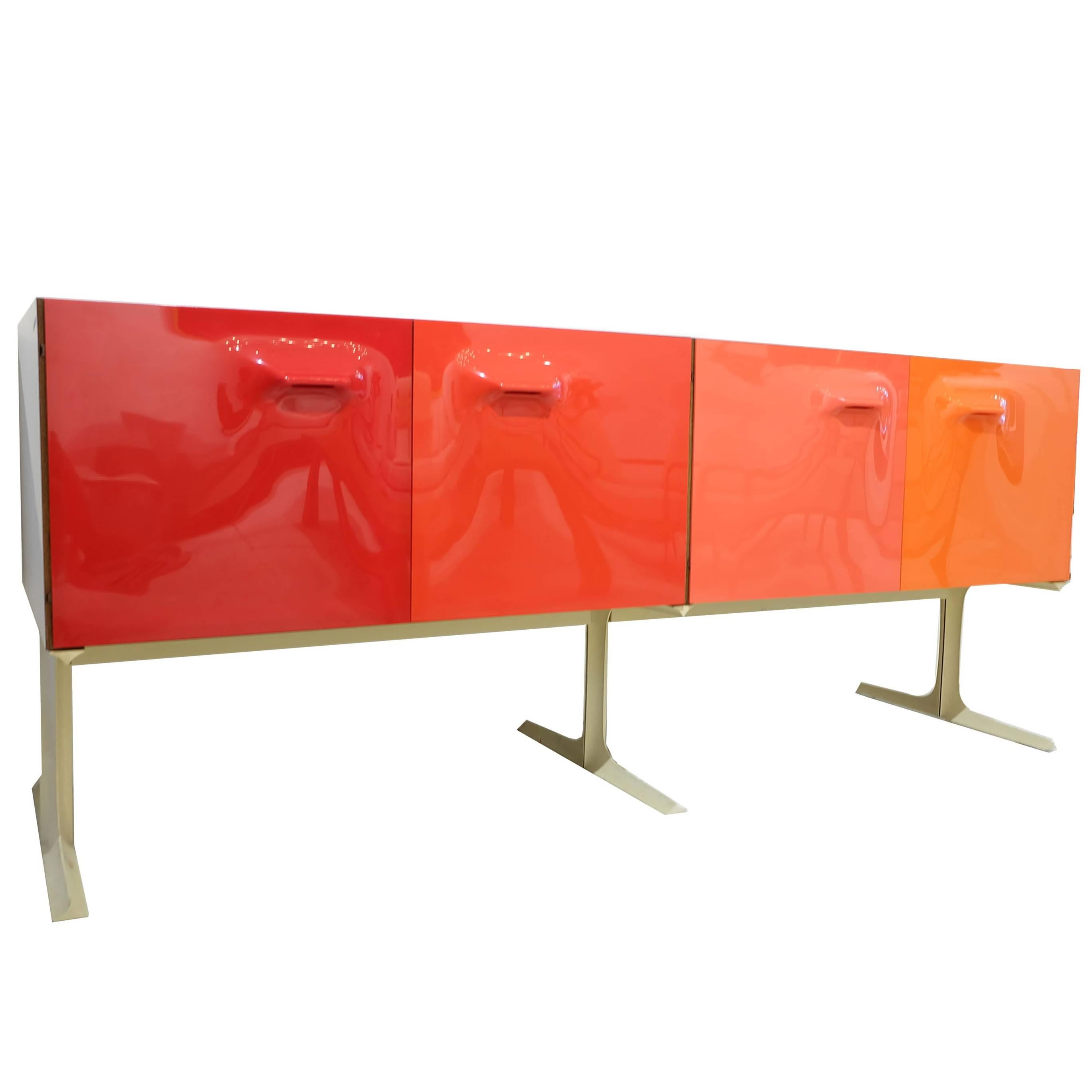 Rare Raymond Loewy for Doubinsky Freres DF-2000 series bar cabinet.
Molded plastic door and drawer fronts organized in the designer's signature graduated bands of color.
Orange and yellow internal drawers; two removable bottle caddies.