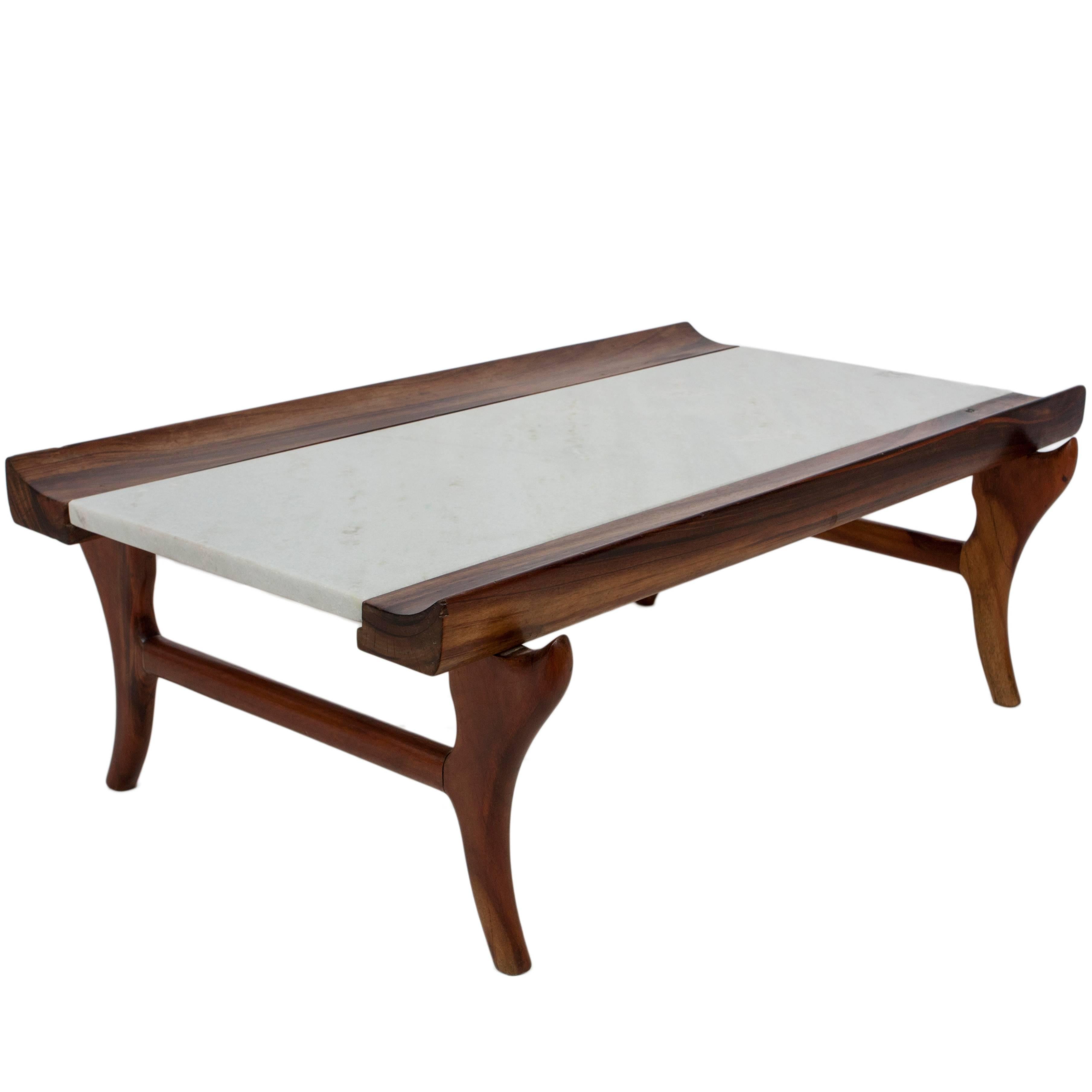 A jacaranda coffee table attributed to Giuseppe Scapinelli with marble top, accented with curved sides, on uniquely formed legs, circa 1960s. Excellent vintage condition, consistent with age and use.