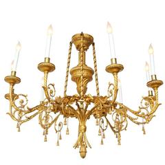 A Louis XVI Style Giltwood Eight-Light Chandelier