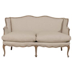 A French Louis XV Style Painted Wood Sofa with New Upholstery, Early 20th C.