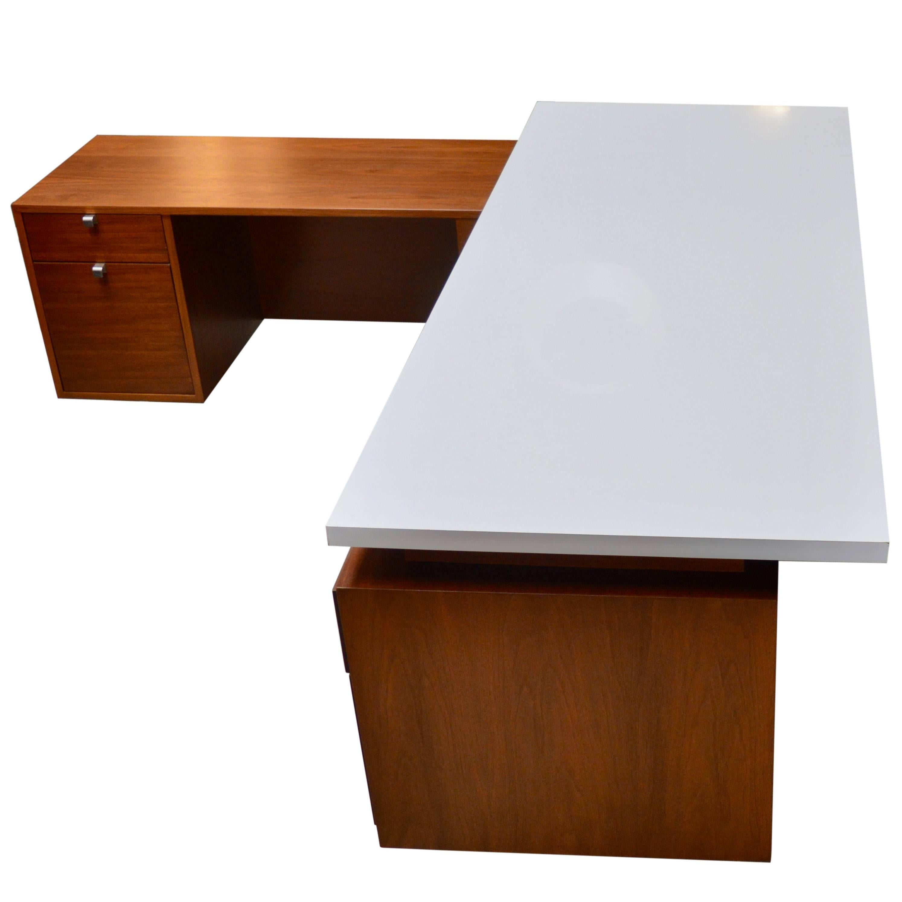 Fantastic desk by George Nelson for Herman Miller. Special custom size. Newly veneered white desktop with dry-erase formica. Allows you to write on the desktop! Walnut desk with chrome hardware. Able to work at the desk or turn to the side and work