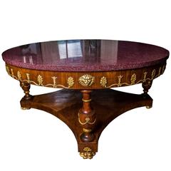 Lustrous Italian porphyry / parcel-gilt cherrywood centre table mid-19th century