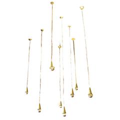 Set of Eight Small Brass Pendants