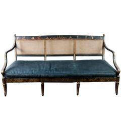 Antique Black and Gilt Painted Regency Caned Settee with Velvet Cushion