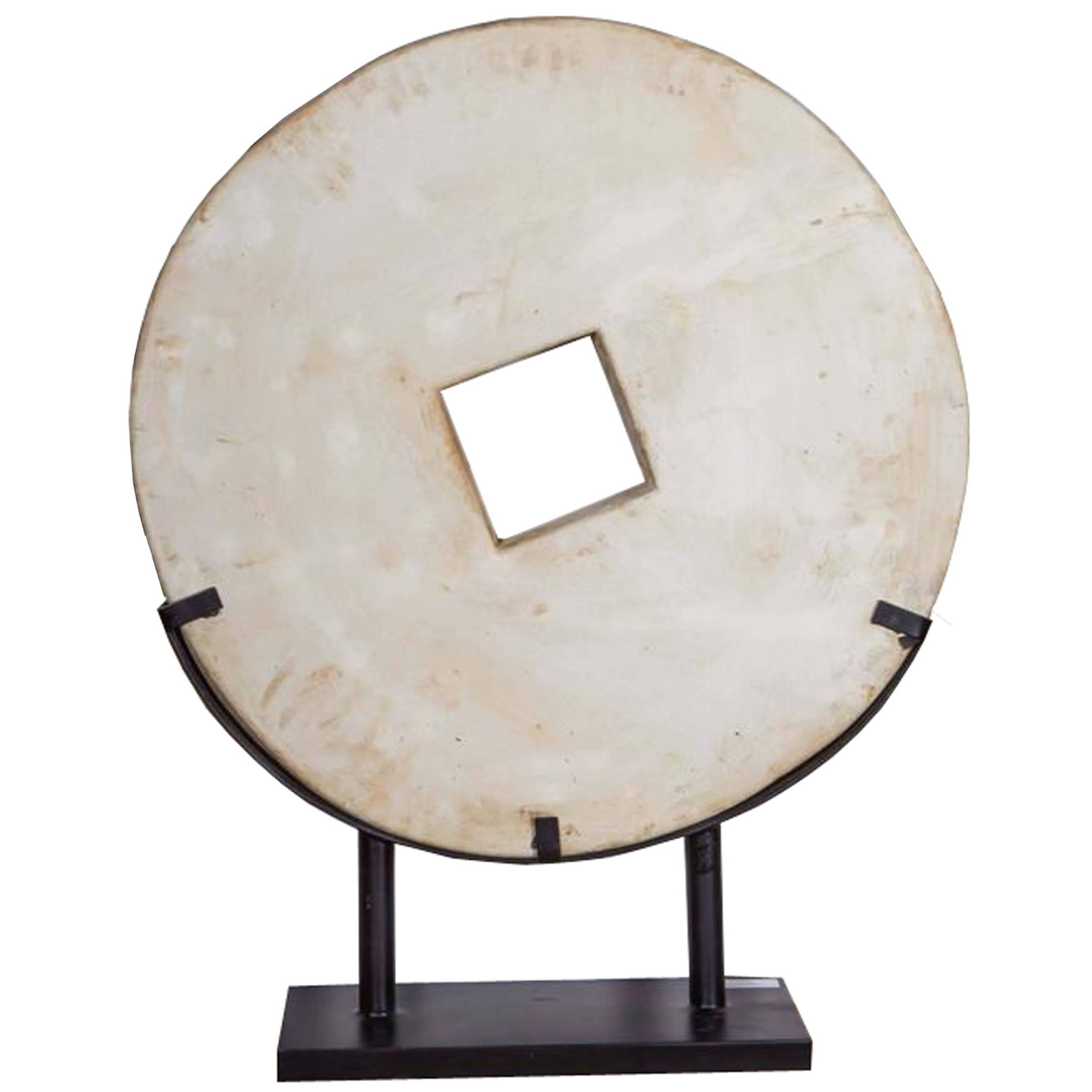 White Stone Coin Sculpture on Stand