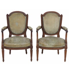 Pair of Antique Louis XVI Style Carved Walnut Fauteuils