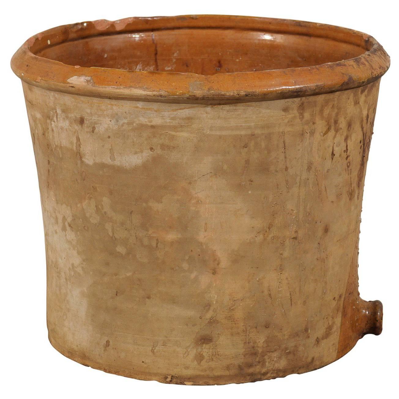 How can I age a terracotta pot?
