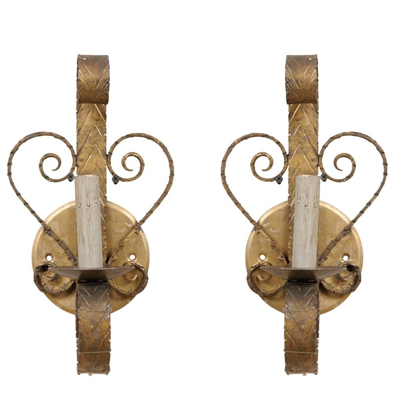 Pair of Spanish Single Light Sconces Each Flanked by Scroll Motifs For Sale