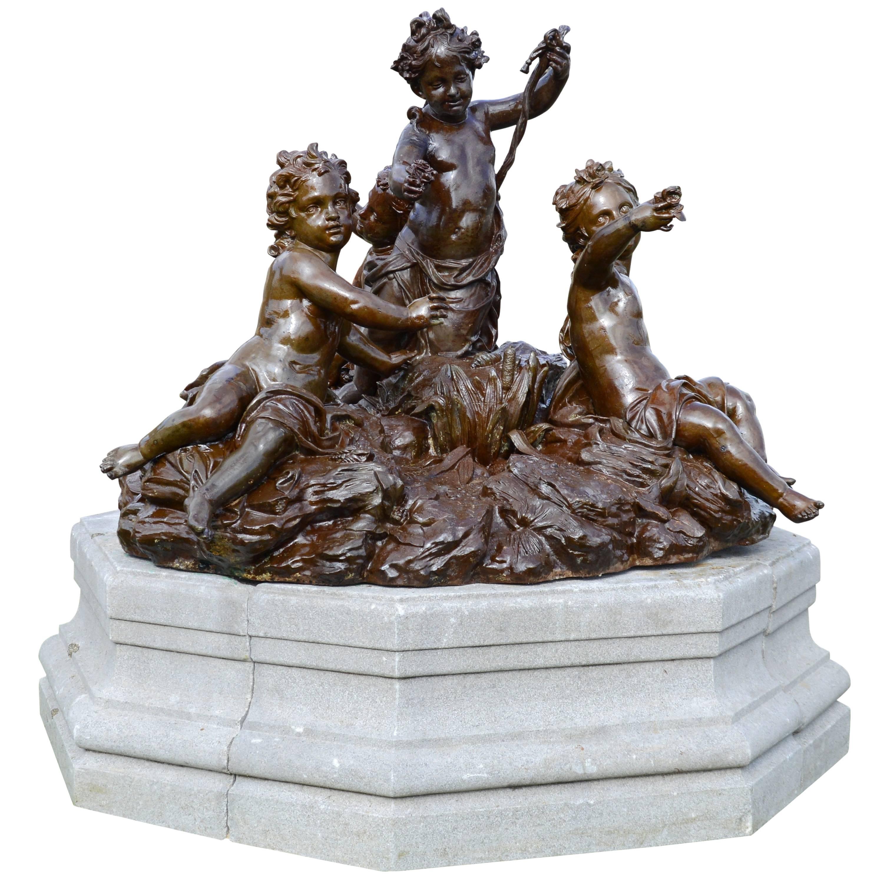 Important Cast Iron Group of Puttti Resting on a Granite Pedestal, 19th Century