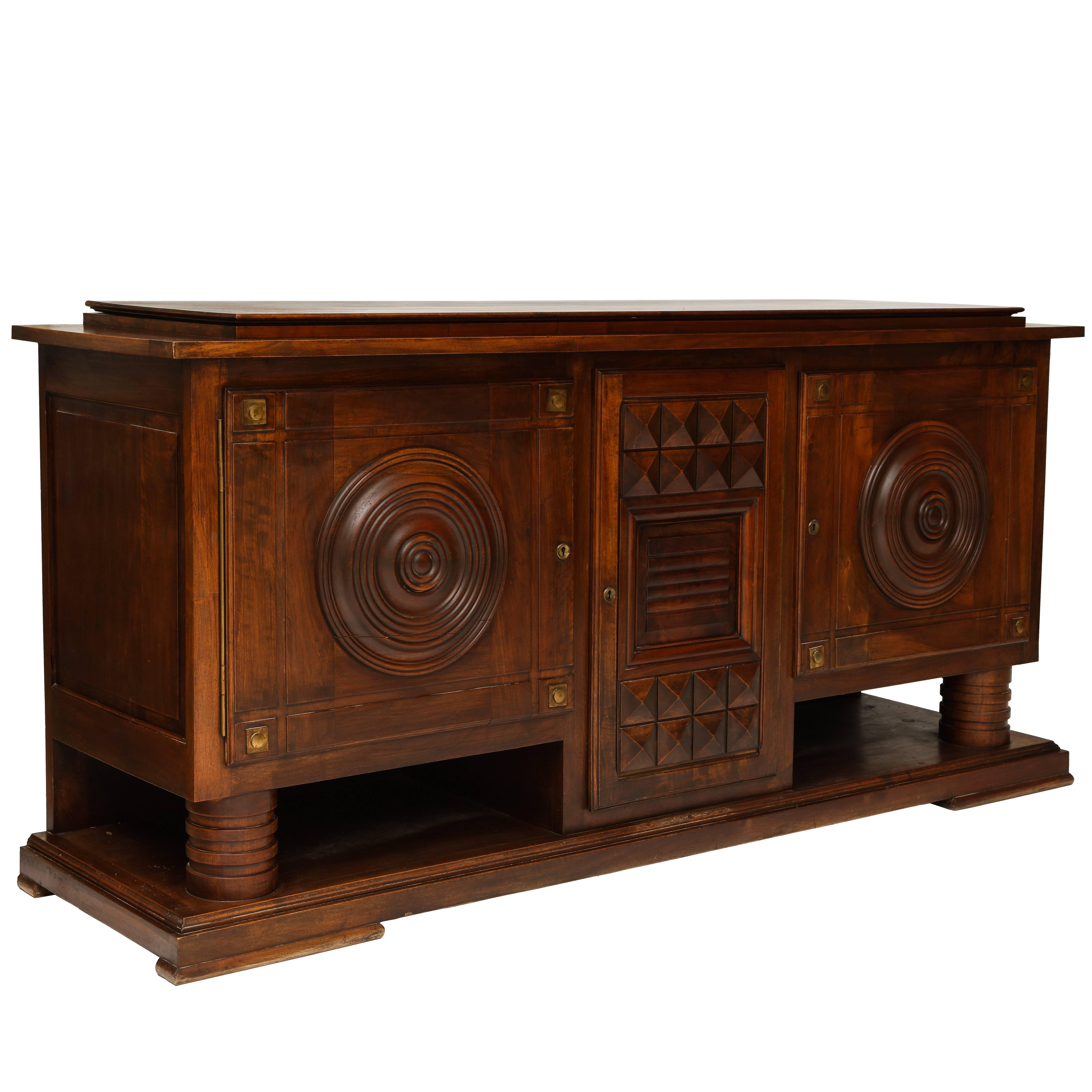 Charles Dudouyt Deco mahogany sideboard buffet, 1930s, France.

Beautiful condition and details mahogany sideboard with incredible carved details and bronze detail. Sculptural and geometric showpiece.

Width: 90 inches.
Height: 40
