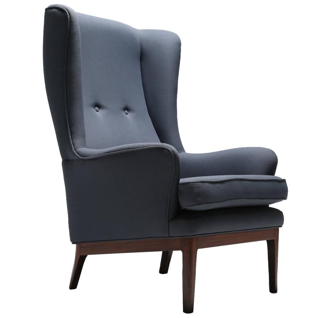 Arne Norell wing armchair, hardwood frame, Scandinavian modern 1960s.