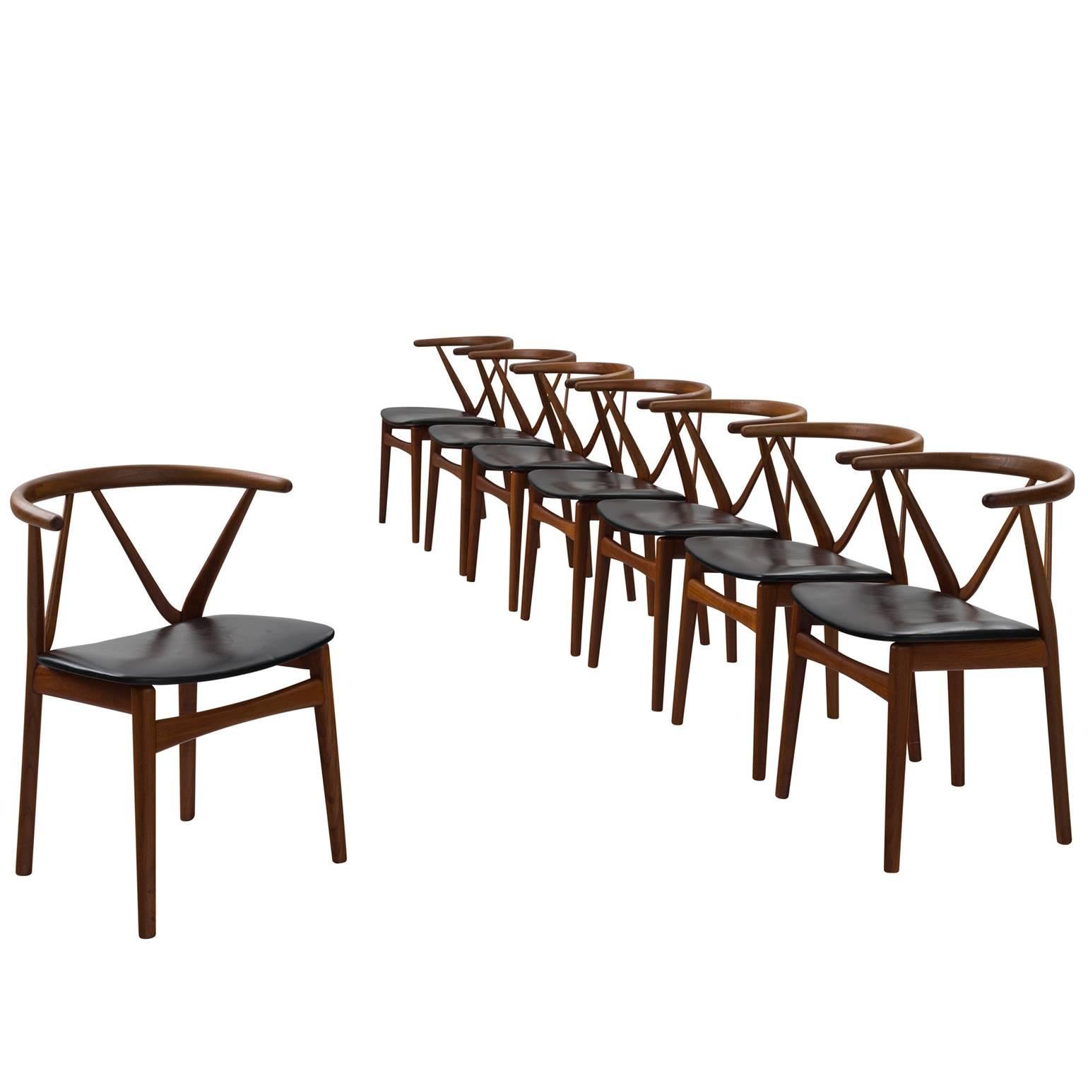 Henning Kjaernulf Set of Eight Dining Chairs in Teak and Black Upholstery