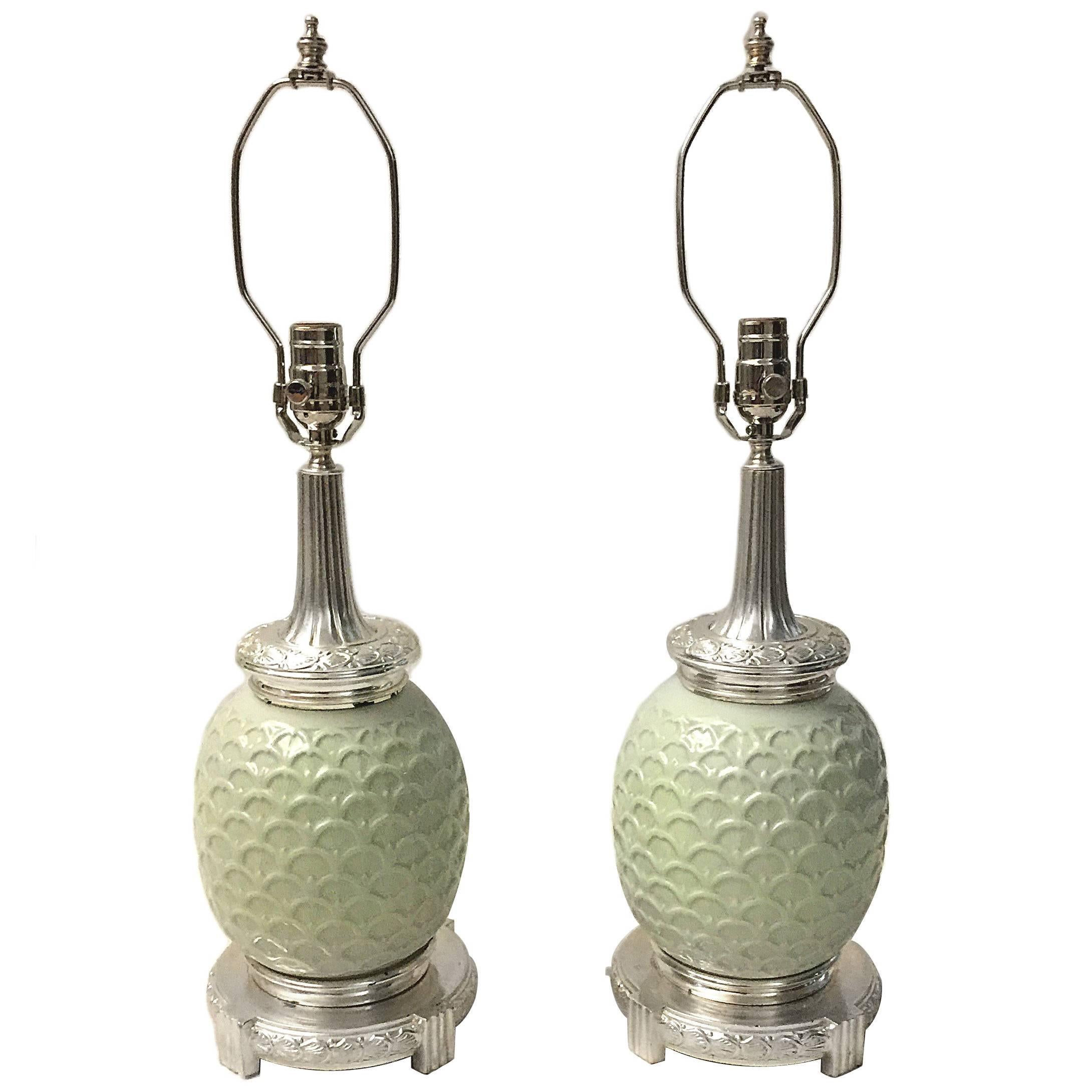 A pair of 1920s French celadon lamps with silver plated mounts.

Measures: 15.5 heigth of body alone.