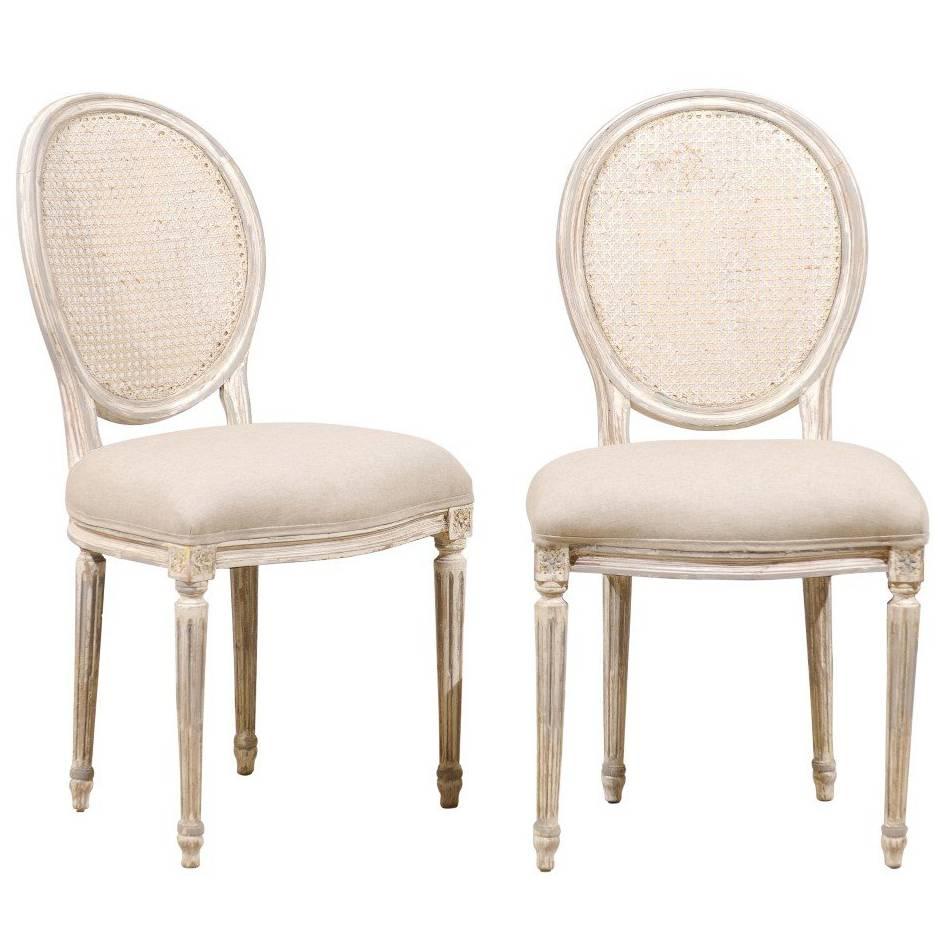 Pair of Louis XVI Style Oval Cane Back Chairs with Fluted Leg