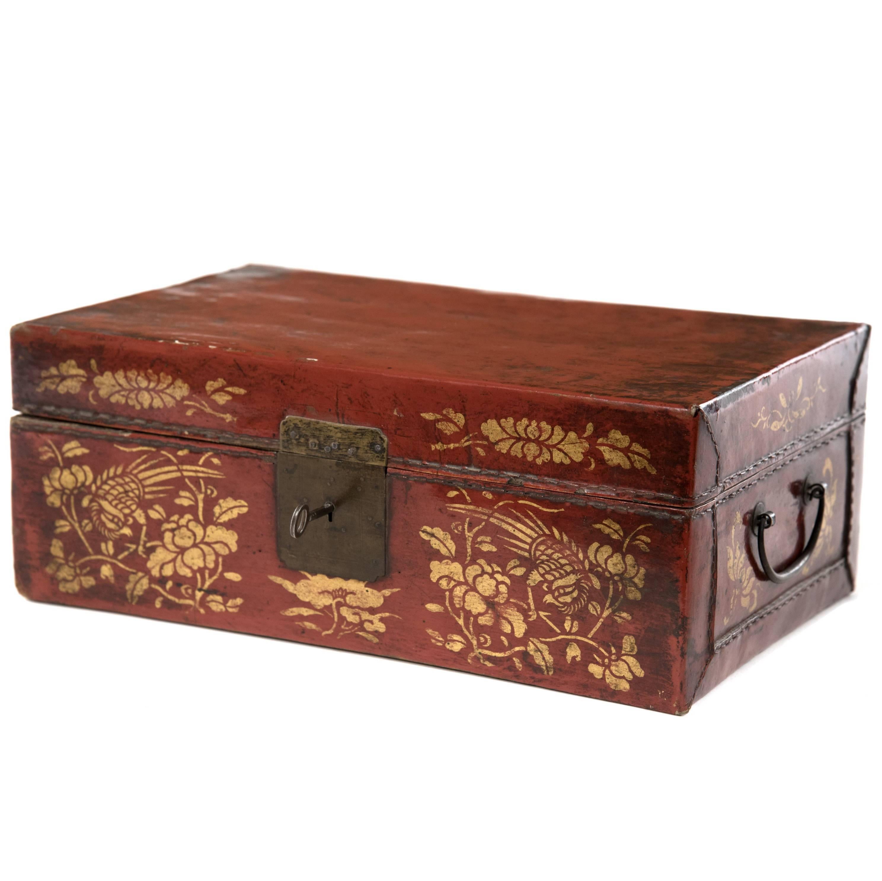 Chinese Red Leather Box with Gold-Stencil Foliate Ornamentation