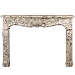 French Régence-Style Fireplace Mantel in Carved Brèche Médicis Marble