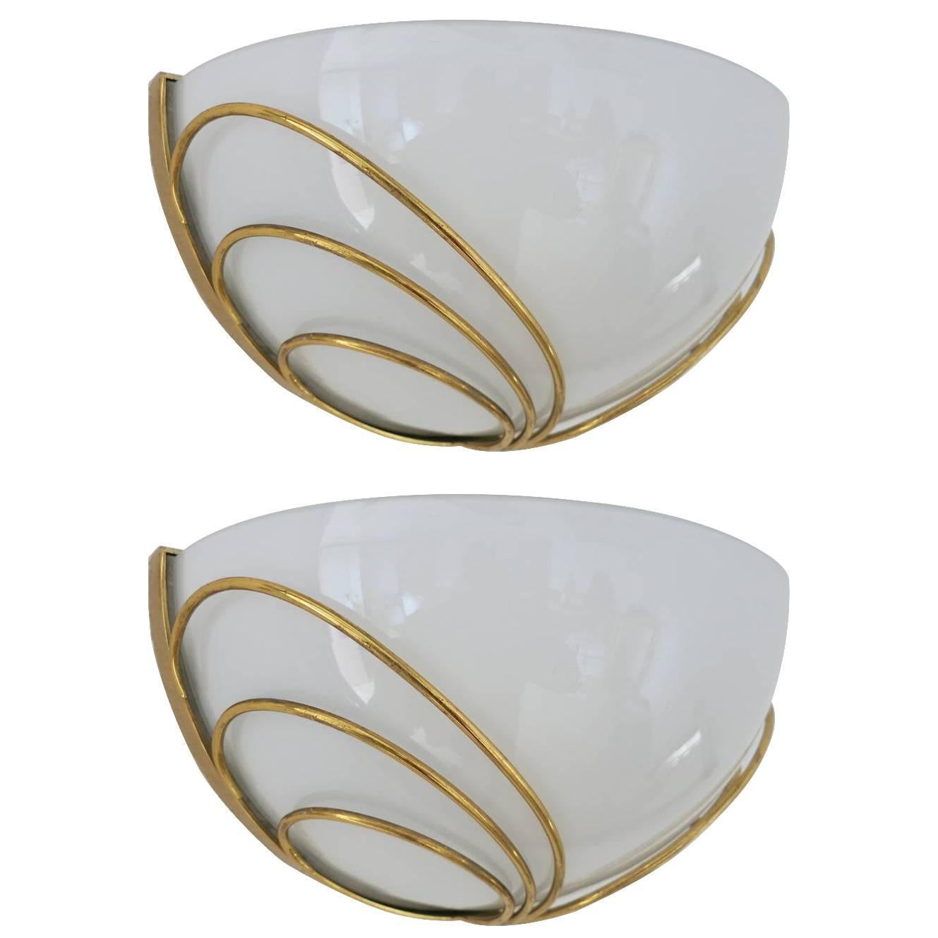 Vintage Italian Art Deco style wall lights with glossy white Murano glasses mounted on brass frames / Made in Italy in the 1960s
1 light / E26 or E27 type / max 60W
Width: 12 inches / Height: 6.5 inches / Depth: 6.5 inches
1 pair in stock in Palm
