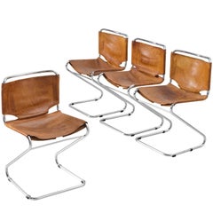 Set of Four Tubular Dining Chairs with Patinated Cognac Leather Upholstery