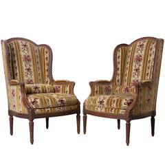 Pair of French 19th Century Walnut Transitional Wingback Bergères 11