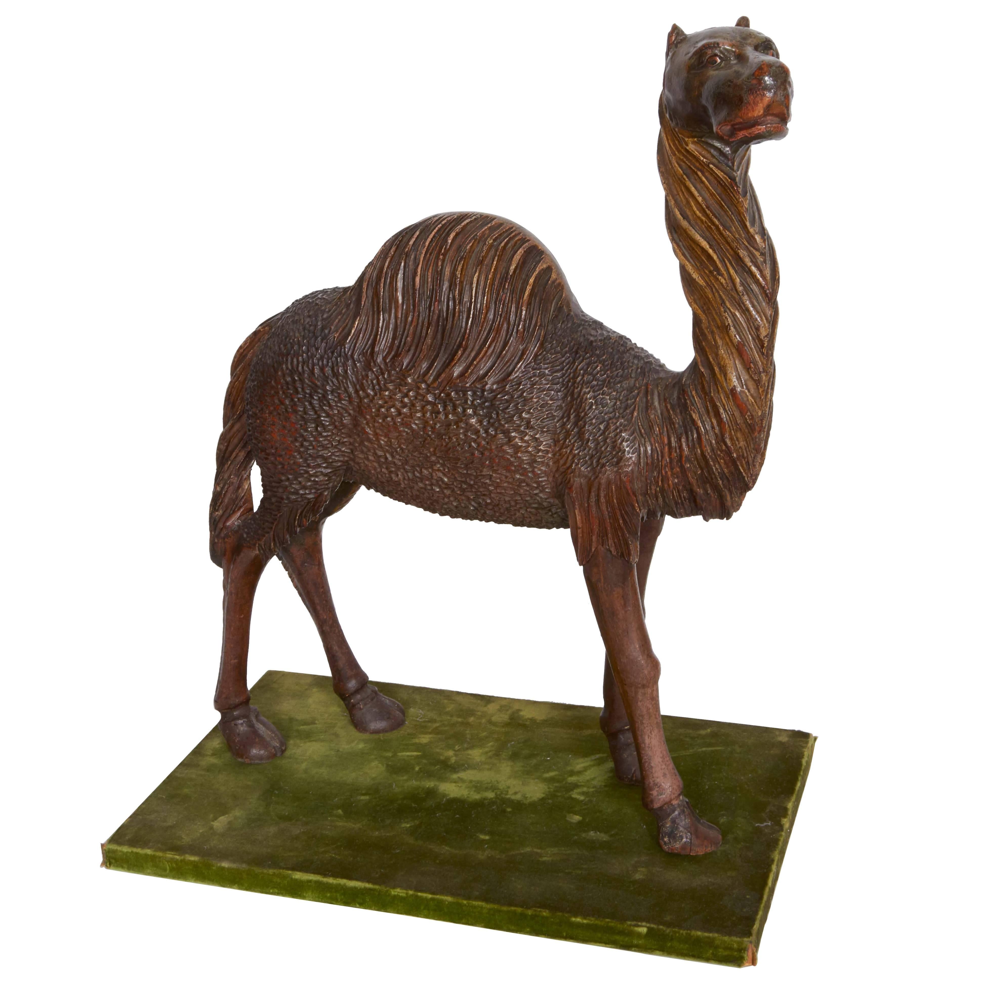 Late 19th Century Carved Wooden Camel on Stand