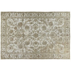 Tapis vintage beige surteint