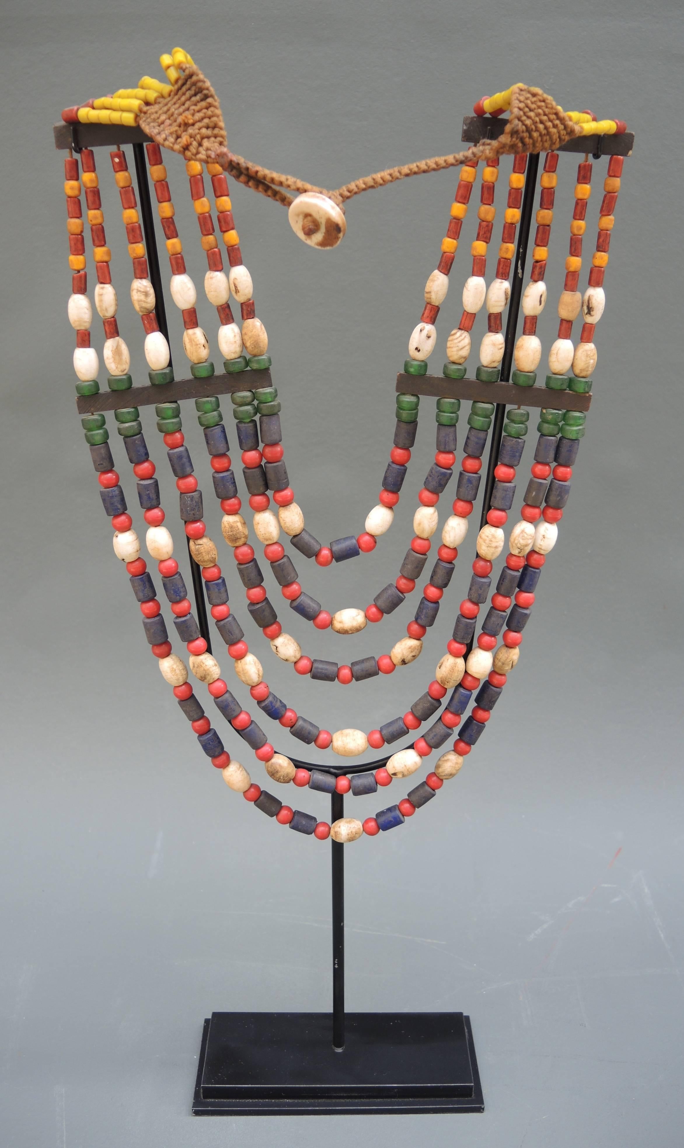 Hand beaded necklaces of glass, pottery and ebony wood from the Angami tribe of Nagaland.
The Naga people are known as expert craftsmen and both men and women adorn themselves with beautifully woven textiles and beaded necklaces. The Naga People are