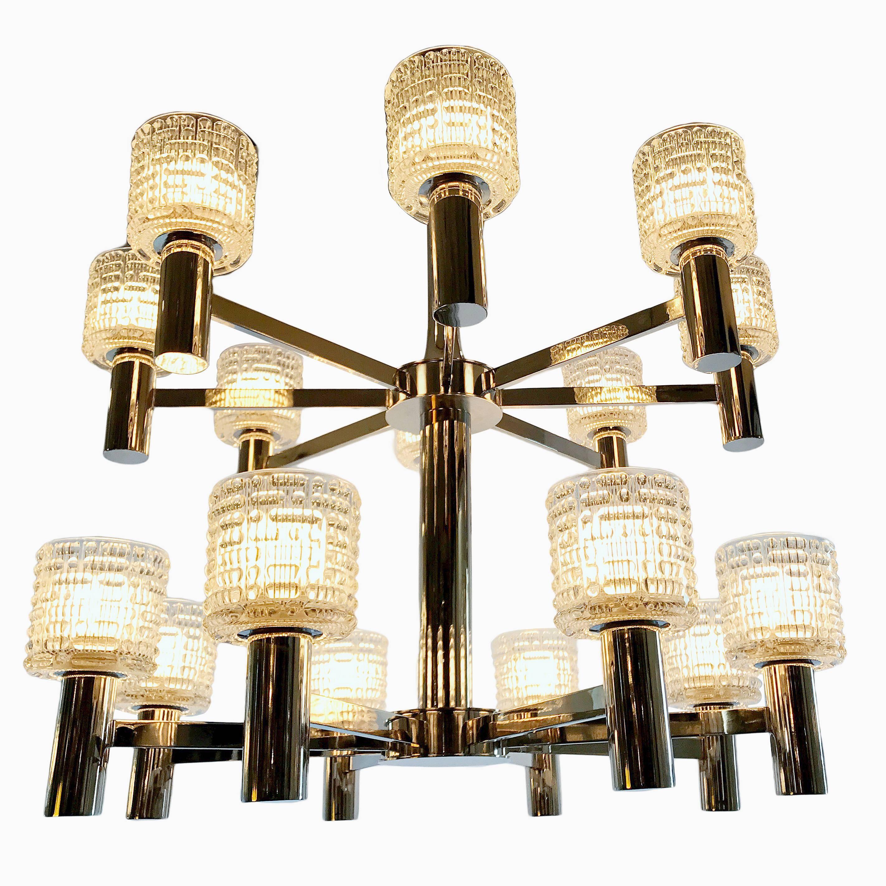 A Swedish circa 1960's double-tiered chandelier with 16 lights, nickel-plated finish, circa 1960s. 

Measurements:
Diameter: 34