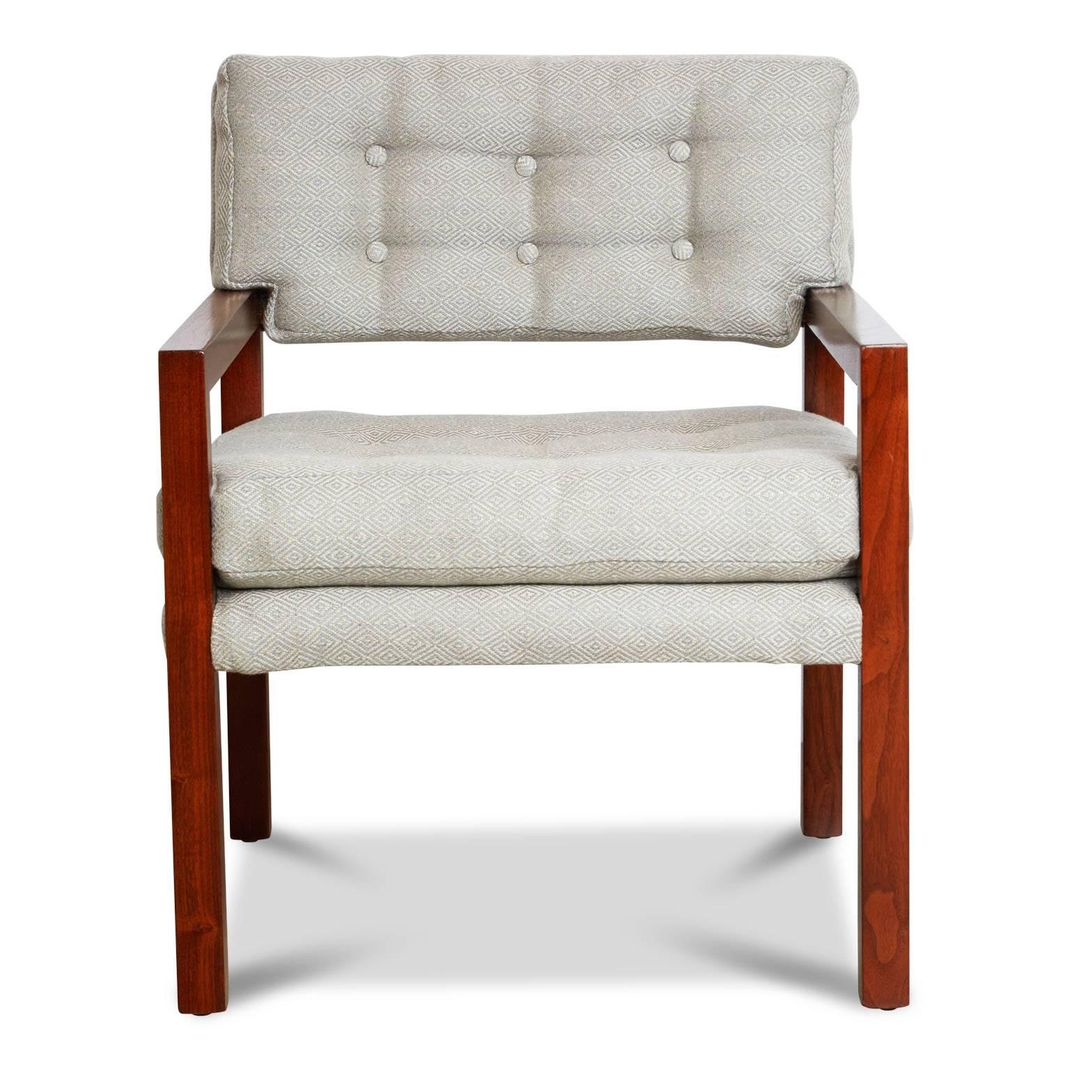 Pair of solid walnut framed armchairs recently refinished in satin lacquer as well as being newly upholstered and button tufted using a light blue and cream woven geometric fabric. 

These graceful armchairs would be ideal in a living room, study,