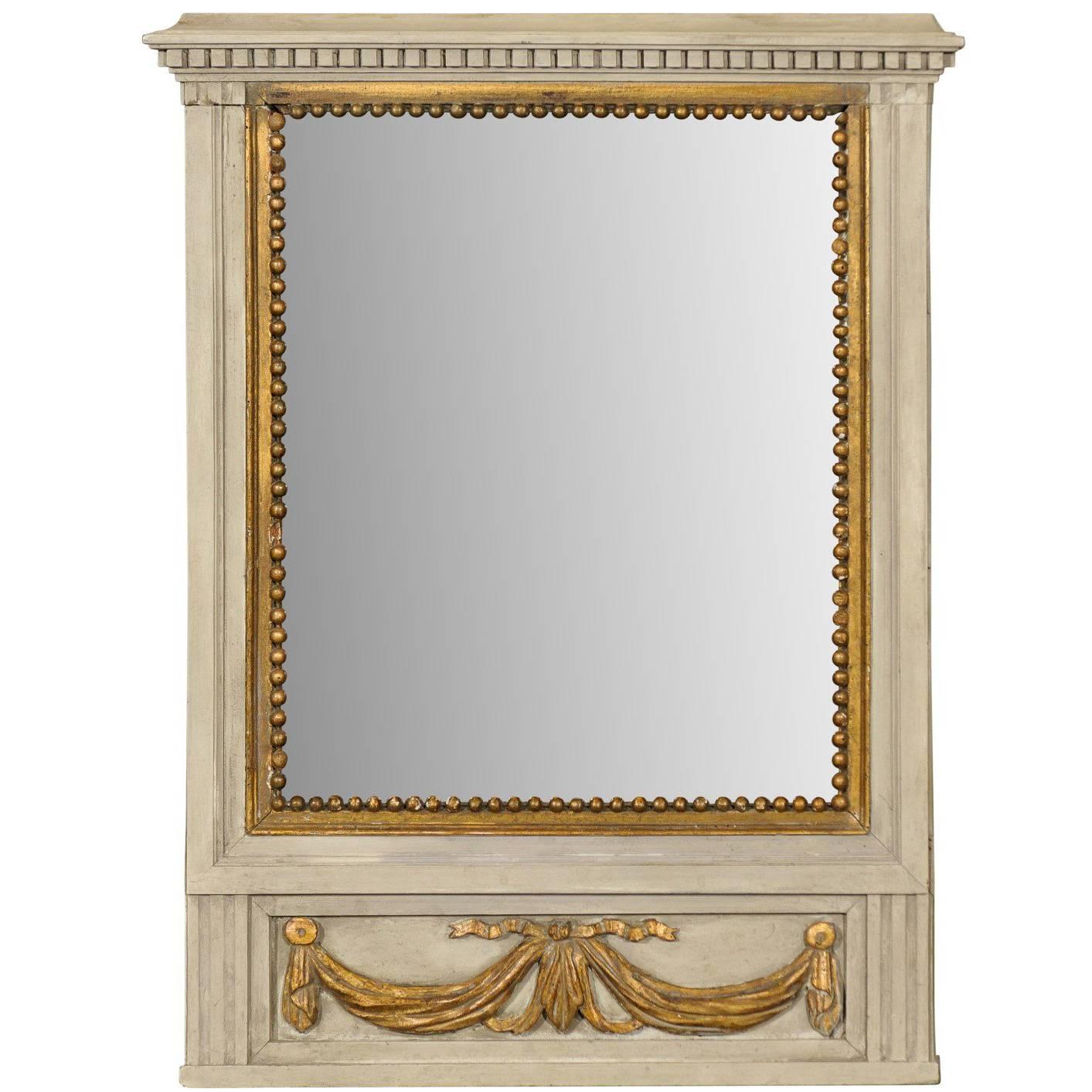 French Mirror in Small Size with Antiqued Glass and Gold Swag Motif on Beige For Sale