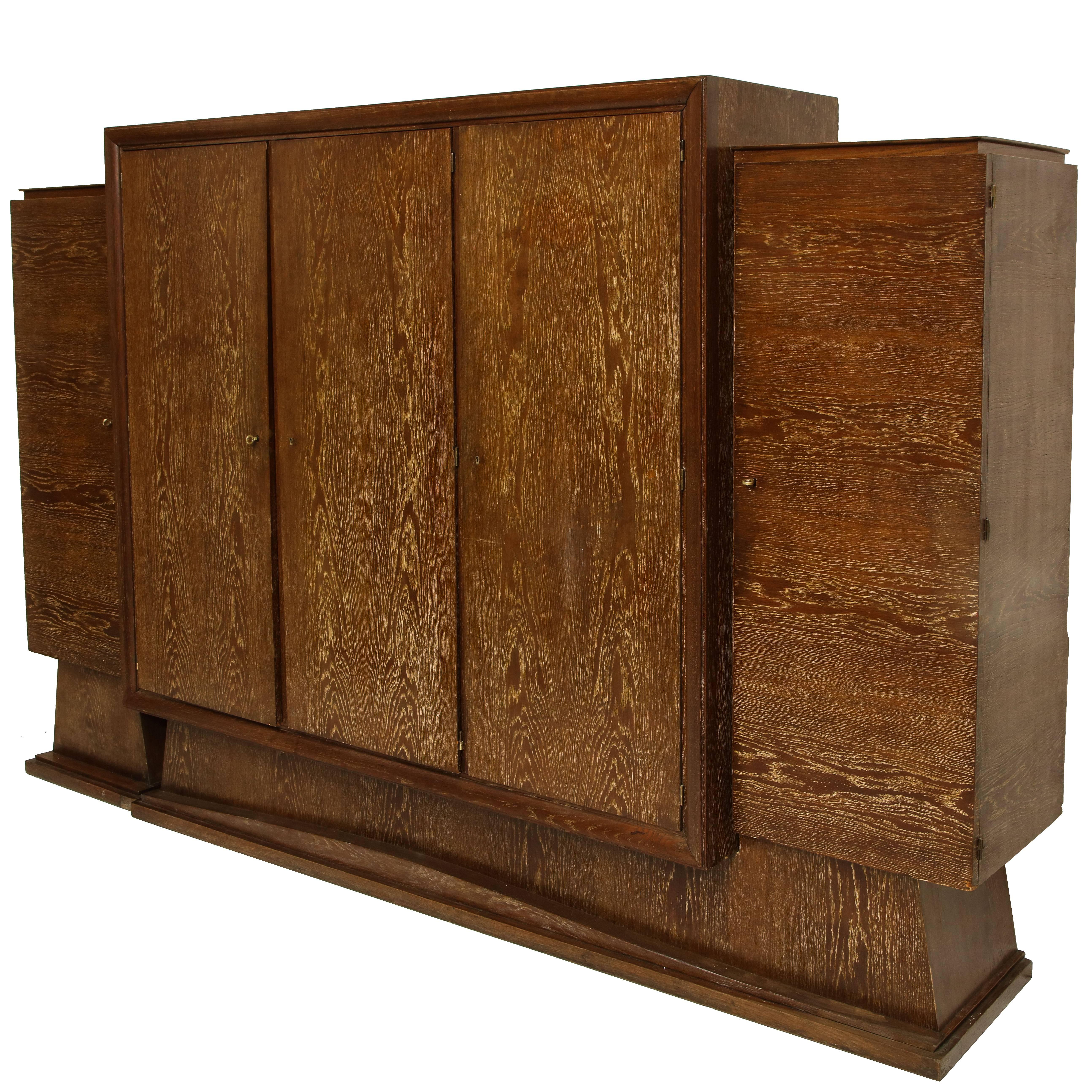 Monumental bookshelf wardrobe library cerused oak deco, France, 1940s, 1930s

Huge scale wardrobe or bookshelf or library in cerused oak from France deco period.
Clean lines. In lovely restored condition with original keys. Many shelves that
