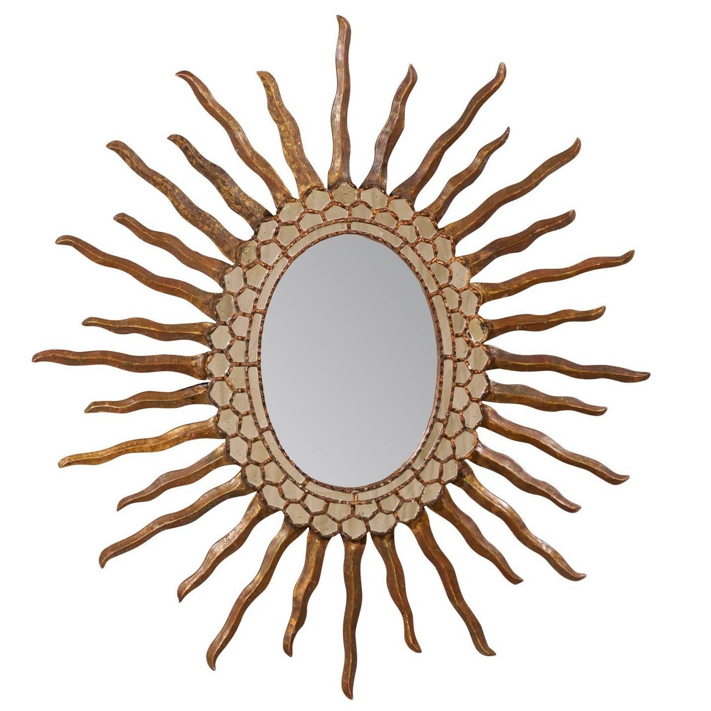 Spanish Oval Shaped Bronze and Gold Antiqued Sunburst Mirror, Intricate Surround