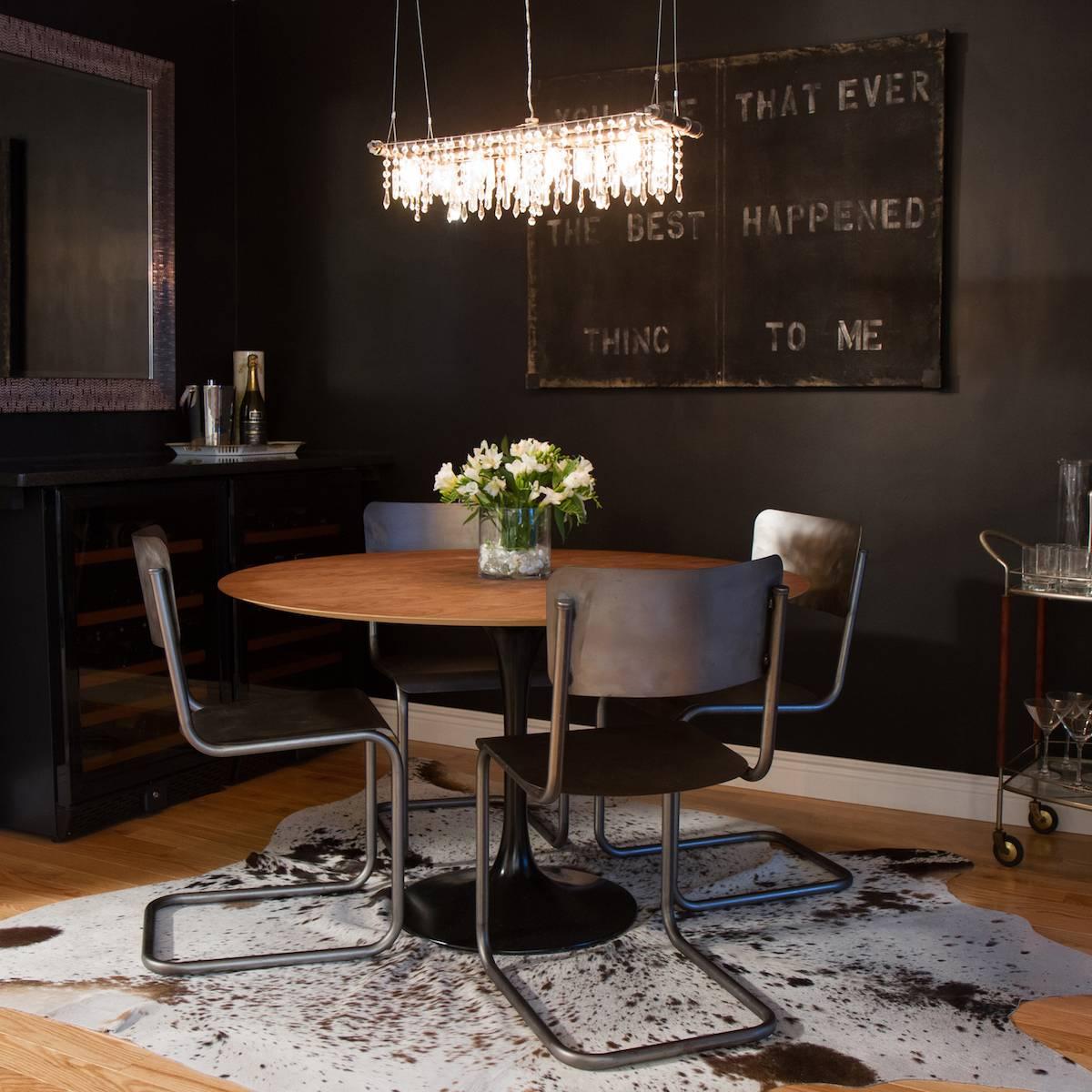 The Tribeca Mini-Banqueting chandelier is a smaller version (eight-bulbs) of our flagship industrial style modern Tribeca Banqueting chandelier and is perfectly suited for modern dining room lighting over smaller tables - and versatile for a wide