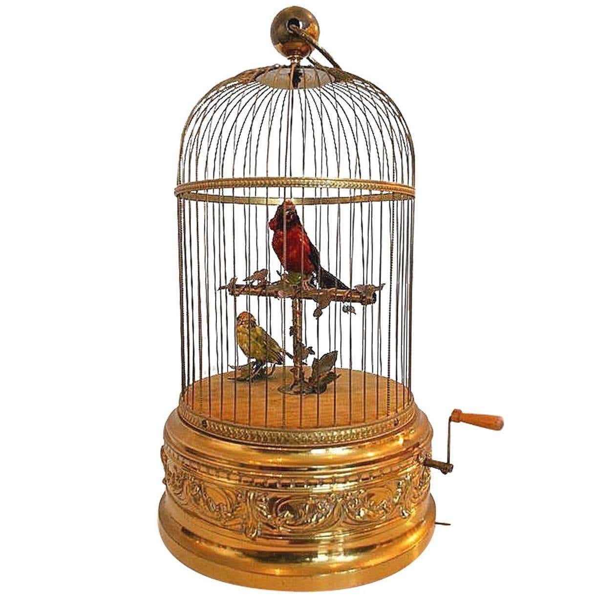 Antique Bontems singing-bird automaton, a separate example of the craft Antique Bontems mechanical singing bird automaton with two birds inside an ornate brass cage