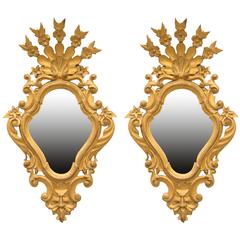 Pair of sculptured wood and gilt mirror's made in 19th century