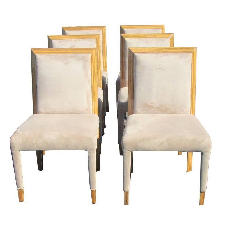 Zebrawood Dining Chairs Set of eight 

Detailed wood and richly veined paired with ultra suede fabric upholstery.
two armchairs and six side chairs

Matching table and credenza. 
   