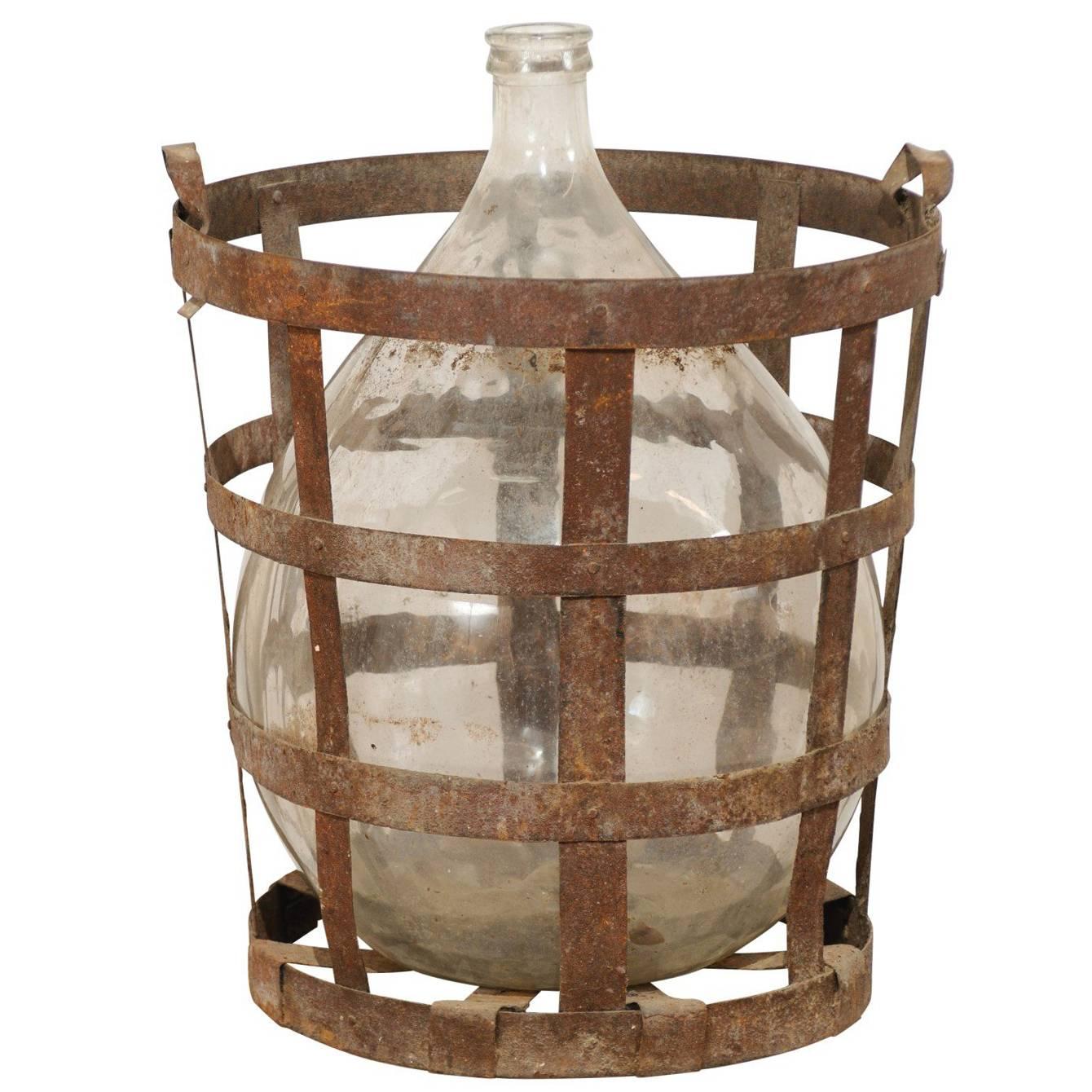 Mid-Century French Patinated Vintner Iron Basket with Demijohn Wine Bottle